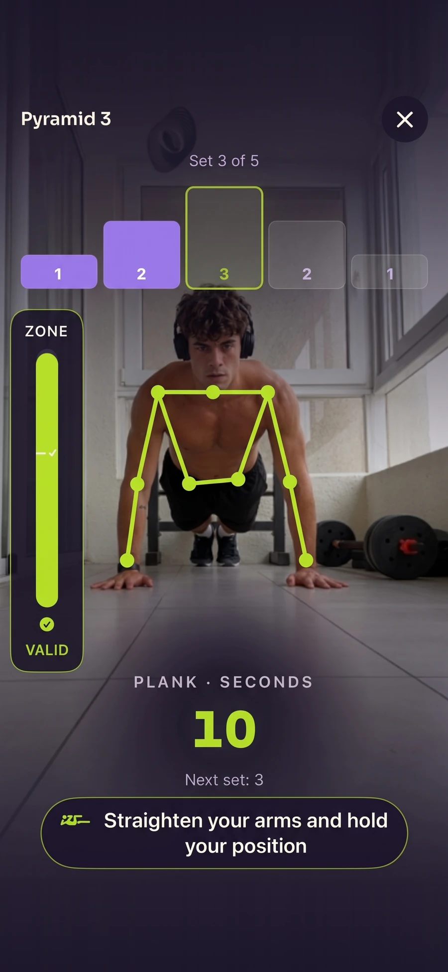 Pyramid in the app: the first two sets done and the high plank holding before set 3